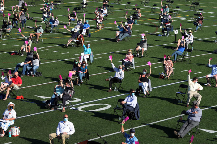 The annual town meeting in North Andover, Mass., which dates back to 1646, was held outside on June 16 on a high school football field to help keep participants a safe distance from each other.