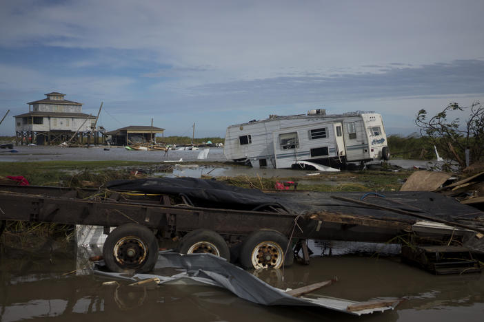 A trailer is left damaged and debris scattered Thursday in Holly Beach, La., in the aftermath of Hurricane Laura.