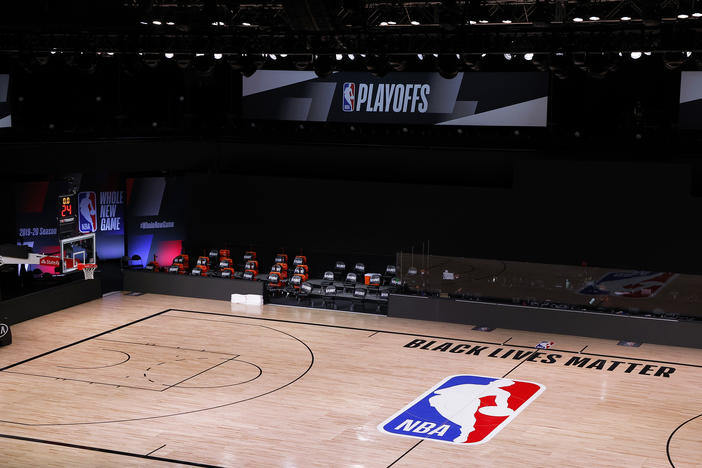 A basketball court is empty where the Milwaukee Bucks had been scheduled to play the Orlando Magic on Wednesday in Lake Buena Vista, Fla. The Bucks and other NBA teams boycotted their games following the police shooting of a Black man in Kenosha, Wis.