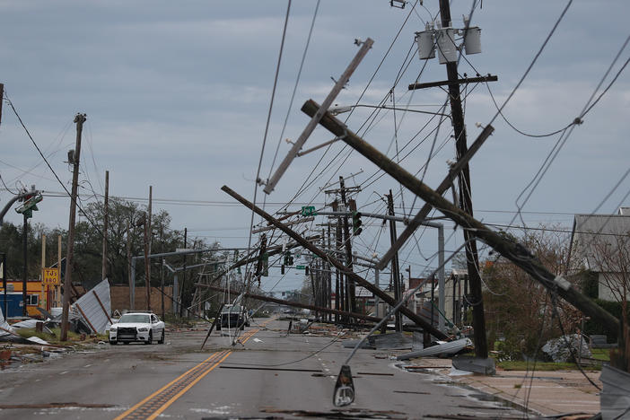 A street is seen strewn with debris and downed power lines after Hurricane Laura passed through Lake Charles, La., on Thursday.