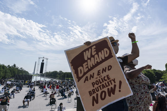 People attend the March on Washington, on Friday at the Lincoln Memorial in Washington, D.C., on the 57th anniversary of the Rev. Martin Luther King Jr.'s "I Have A Dream" speech.