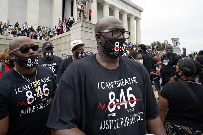 Philonise Floyd, right, brother of George Floyd, gets ready to march from the Lincoln Memorial to the Martin Luther King Jr. Memorial, during the March on Washington on Friday.