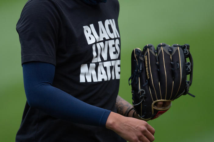 A Milwaukee Brewers player wears a Black Lives Matter shirt before a game with the Chicago White Sox earlier this month in Chicago.