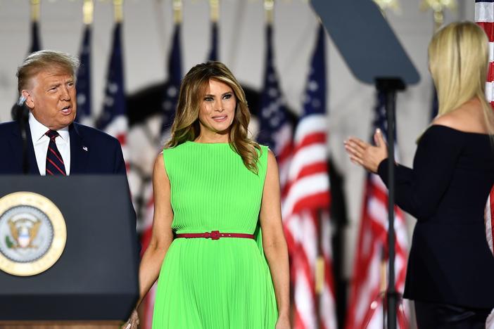First Lady Melania Trump, center, in a bright, lime green dress at last night's Republican National Convention. It's a color begging to be photoshopped, and the Internet reliably delivered.