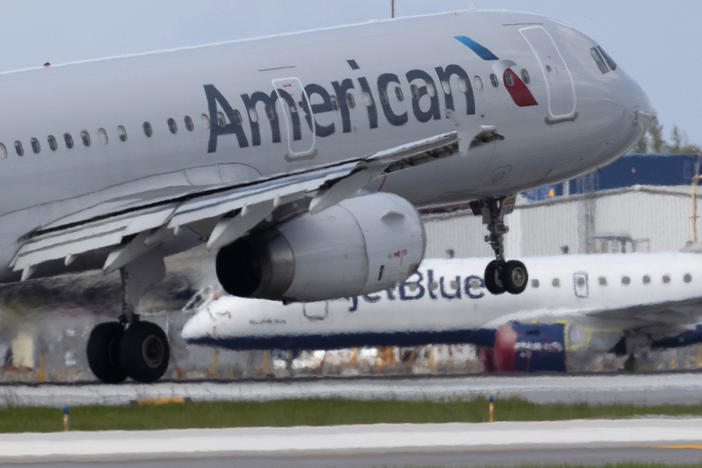 An American Airlines plane lands at the Fort Lauderdale-Hollywood International Airport on July 16, 2020. Air traffic has rebounded a bit but it's way below pre-coronavirus levels.