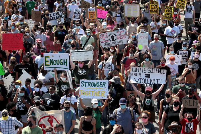 People march in support of Jacob Blake and his family to the Kenosha County Courthouse on August 29, 2020 in Kenosha, Wisconsin. Blake was shot seven times in the back in front of his three children by a police officer in Kenosha.