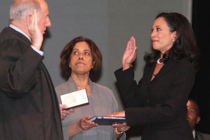 Kamala Harris receives the oath of office from California Supreme Court Chief Justice Ronald M. George during her inauguration on Jan. 8, 2004, as San Francisco's district attorney. In the center is Harris' mother, Shyamala Gopalan.