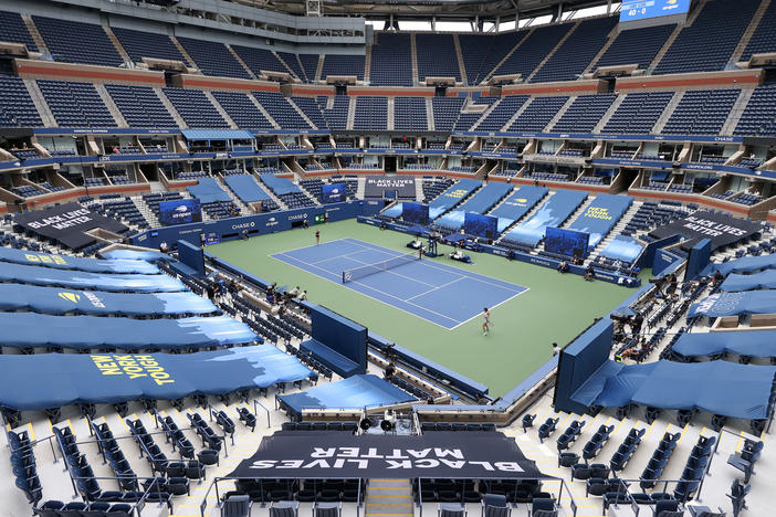Karolina Pliskova of the Czech Republic and Anhelina Kalinina of Ukraine play their first-round match at a mostly empty Arthur Ashe Stadium on Monday. This year's U.S. Open is taking place without spectators because of the coronavirus pandemic.