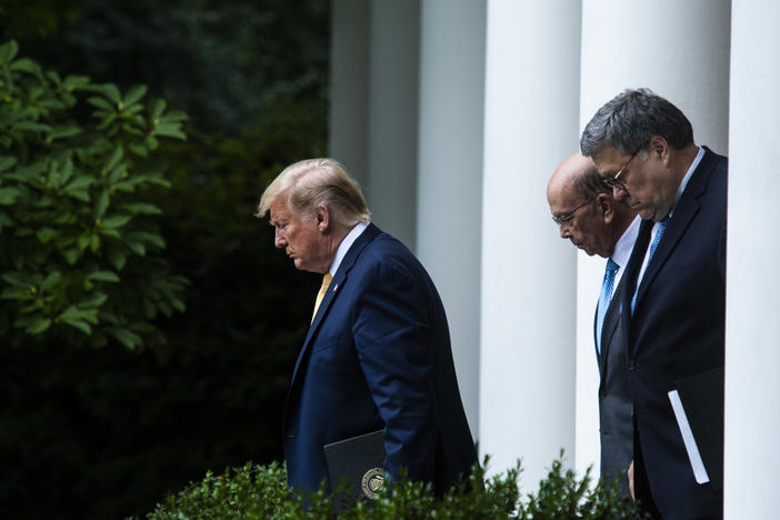 President Trump, Commerce Secretary Wilbur Ross (center) and Attorney General William Barr walk into the White House Rose Garden for a July 2019 press conference on the census.