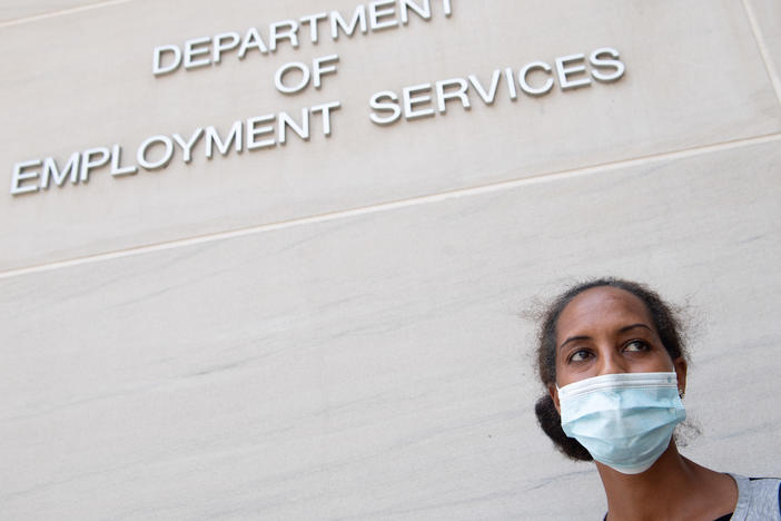 Diana Yitbarek seeks information about her unemployment claim in Washington, D.C., in July. Applications for jobless benefits nationwide have been dropping but remain very high by historical standards.