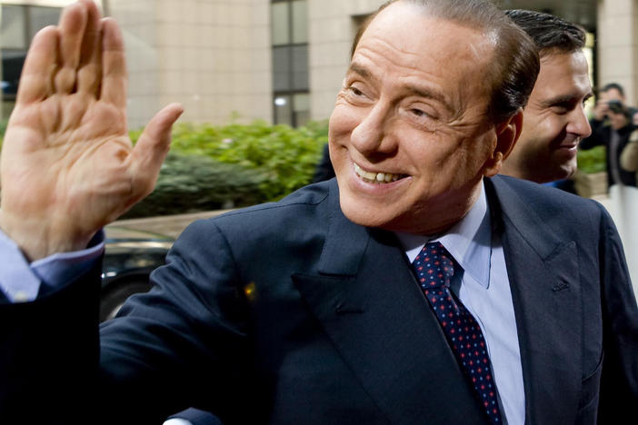 Former Italian Prime Minister Silvio Berlusconi waving at  members of the media in Rome, Italy, in 2011. Berlusconi's staff announced Wednesday that he has tested positive for coronavirus but is showing no symptoms at present.