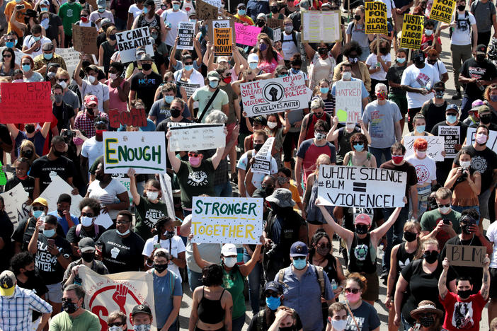 People march in support of Jacob Blake and his family to the Kenosha County Courthouse in Kenosha, Wis., in August.