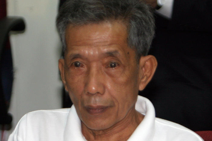 Former Khmer Rouge prison chief Kaing Guek Eav appears in a courtroom of the Extraordinary Chambers in the Courts of Cambodia in 2007.