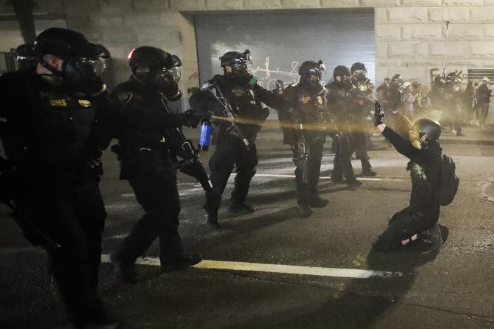A demonstrator is pepper-sprayed July 30 shortly before being arrested during a Black Lives Matter protest at the Mark O. Hatfield United States Courthouse in Portland, Ore.