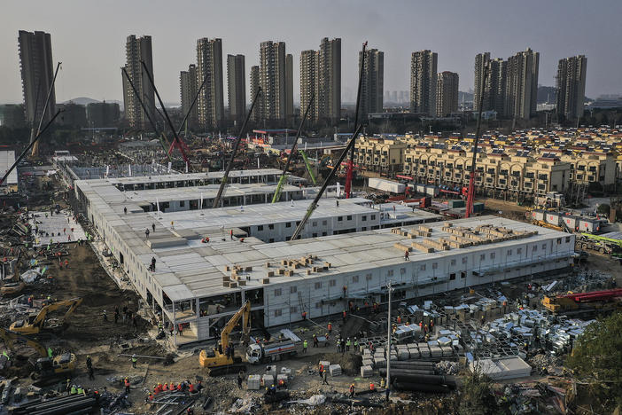 On Jan. 23, workers started building the Huoshenshan hospital for COVID-19 patients in Wuhan, China. The photo above was taken on Jan. 30. Construction was done on Feb. 2, and the 1,000-bed hospital opened on Feb. 3. Today it stands empty of patients.