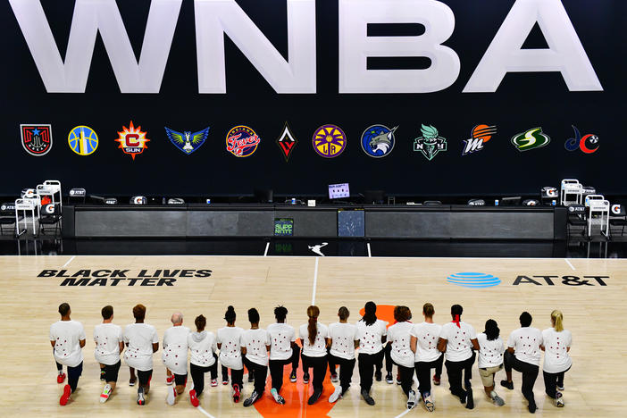 After the WNBA announcement of the postponed games for the evening, the Washington Mystics each wear white T-shirts with seven bullets on the back protesting the shooting of Jacob Blake by Kenosha, Wisconsin police at Feld Entertainment Center on August 26, 2020 in Palmetto, Florida.
