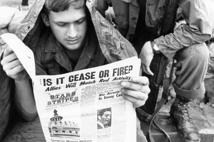 U.S. troops in the Vietnam War read the <em>Stars and Stripes</em> newspaper in 1969. The Pentagon plans to shut down the paper, for generations aimed at U.S. military personnel, at the end of this month.