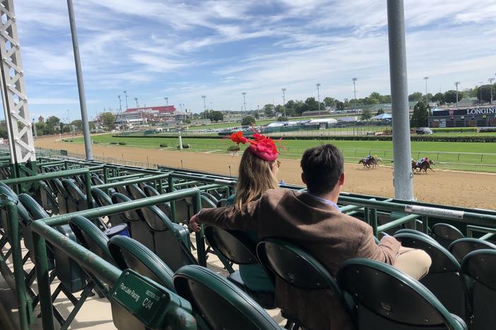 Spectators in an otherwise empty grandstand watch the Kentucky Oaks at Churchill Downs on Sept. 4. Oaks is typically a daylong party, a kick-off to the Kentucky Derby, which runs the following day.