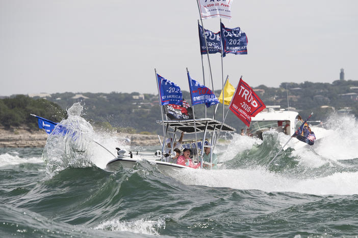 Boaters flying flags honoring President Trump crowded Lake Travis in Texas on Saturday. Although this boat did not capsize, a spokesperson for the Travis County Sheriff's Office said "several" boats sank.