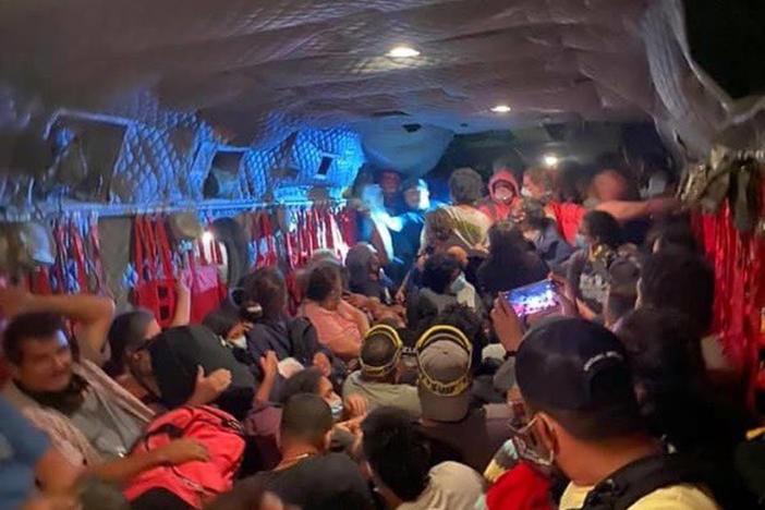Dozens of people are evacuated to safety on a California National Guard Chinook helicopter on Saturday after the Creek Fire in central California left them stranded. More than 200 people were airlifted to safety after the fast-moving wildfire trapped them in a popular camping area in Sierra National Forest.