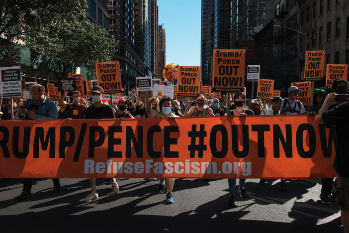 People march during the nationwide protest demanding the end to the Trump administration in New York City on Saturday. Protesters have often accused President Trump of being fascist.