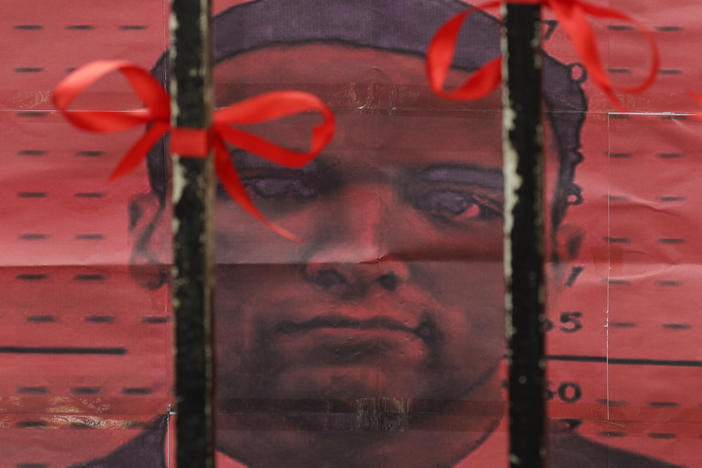 U.S. Marine Lance Cpl. Joseph Scott Pemberton is seen from behind the gates of the Department of Justice in Manila, Philippines. Philippines President Rodrigo Duterte granted Pemberton a pardon following his conviction in the 2014 killing of a transgender Filipino woman.