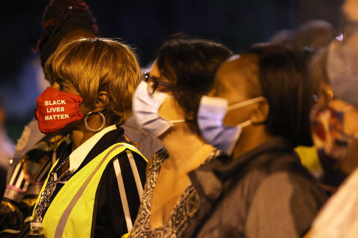 Elders stand on the front line in a march for Daniel Prude on Sunday in Rochester, N.Y. Prude died in March a week after police pinned him to the ground. It was the fifth consecutive night of protesting since the release of police body-camera footage of Prude's arrest.