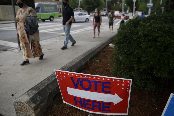 People wait in line to vote in Georgia's primary election on June 9 at Park Tavern in Atlanta.