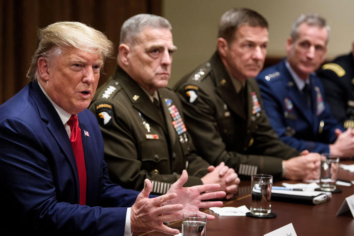Army Gen. Mark Milley (second from left), chairman of the Joint Chiefs of Staff, and others listen as President Trump speaks during a meeting with senior military leaders in October.