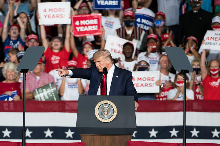 President Trump addresses the crowd during a campaign rally Tuesday at Smith Reynolds Airport in Winston Salem, N.C.