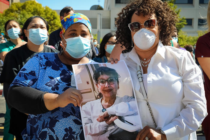 Worried registered nurses held a vigil in July at Sutter Health's Alta Bates Summit Medical Center in Oakland, Calif., to remember their colleague Janine Paiste-Ponder, who caught COVID-19, likely from a patient, and died from complications.