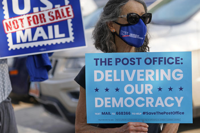 Postmaster General Louis DeJoy says it's his "sacred duty" to ensure election mail delivery this fall.