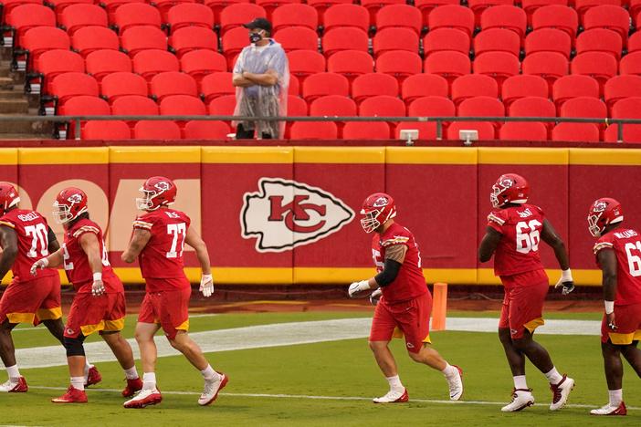 In this Aug. 29 file photo, Kansas City Chiefs players run during NFL football training camp at Arrowhead Stadium in Kansas City, Mo.