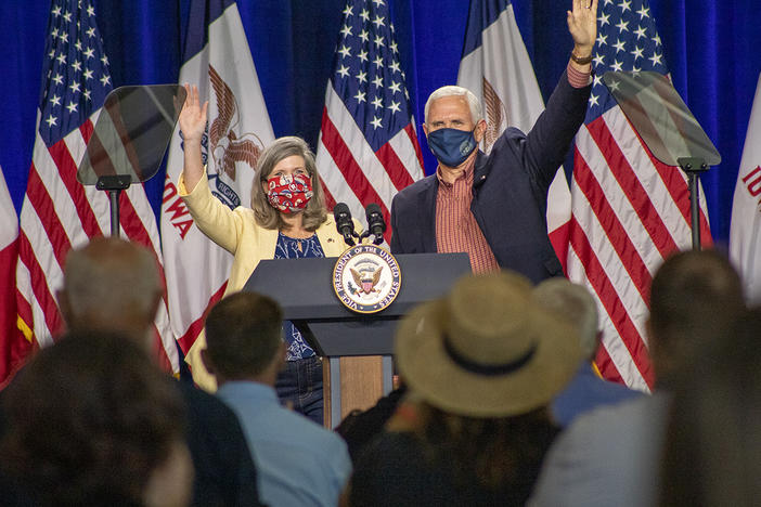 U.S. Sen. Joni Ernst, R-Iowa, appears on stage with Vice President Mike Pence in Des Moines on Aug. 13. Ernst is locked in a close race for reelection this fall against Democrat Theresa Greenfield.
