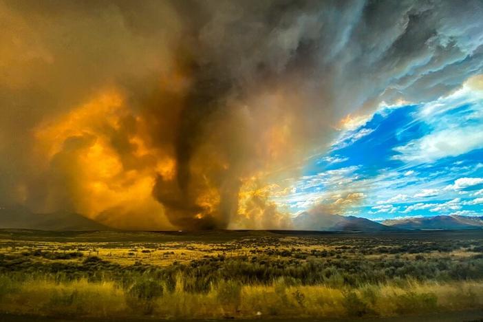 A funnel appears in a thick plume of smoke from the Loyalton Fire last month in Lassen County, Calif. It is one of many wildfires to have hit the state recently.