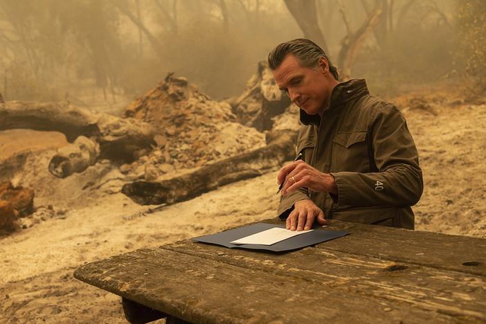 California Gov. Gavin Newsom signs Assembly Bill 2147 after he toured the North Complex Fire zone on Friday.  The bill allows inmates who have worked as firefighters to ask the court to dismiss their charges to make it easier for them to find a job once they are released. People convicted of certain violent or sex crimes would not be eligible.