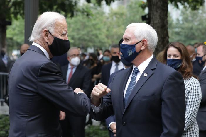 Democratic presidential candidate Joe Biden greets Vice President Pence at the 9/11 Memorial in New York to commemorate the 19th anniversary of the Sept. 11 attacks on Friday.
