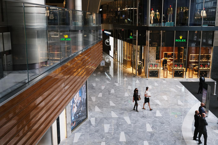 People walk through the newly reopened mall at Hudson Yards in New York. U.S. shoppers spent more prudently in August and retail sales grew a tepid 0.6% from July.