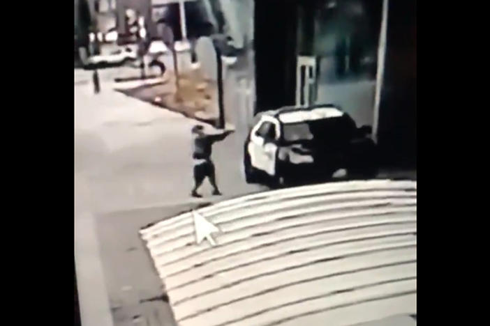 A screen grab from a security camera video released by the Los Angeles County Sheriff's Department shows a gunman walking up to sheriff's deputies and opening fire without warning or provocation in Compton, Calif., on Sept. 12.