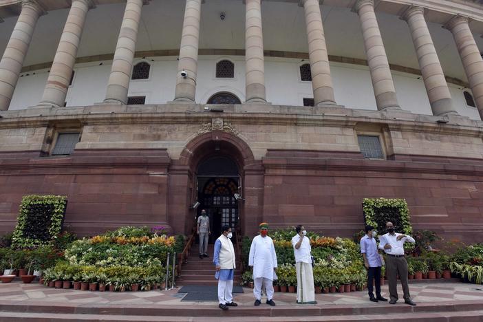 Politicians gathered at India's Parliament House ahead of the first session in six months, on Sept. 13 in New Delhi. Lawmakers were required to get tested for the coronavirus within 72 hours before entering parliament.