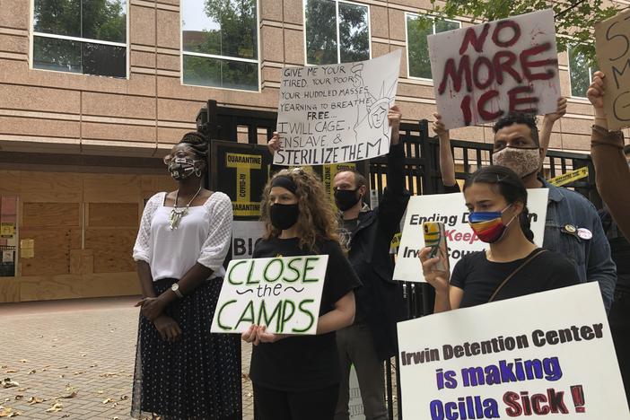 Dawn Wooten (left), who filed the whistleblower complaint about conditions at the Irwin County Detention Center, participates in a news conference Tuesday in Atlanta.