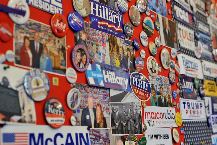 A collection of current and past presidential advertising materials hangs on a wall in the visitor center of the New Hampshire State House in Concord, N.H.
