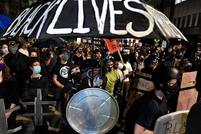 Demonstrators march through the streets of Rochester, N.Y., earlier this month protesting the death of Daniel Prude, apparently stopped breathing as police were restraining him in March.