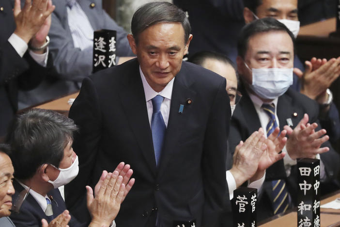 Yoshihide Suga receives applause Wednesday after being elected as Japan's new prime minister at Parliament's lower house in Tokyo.
