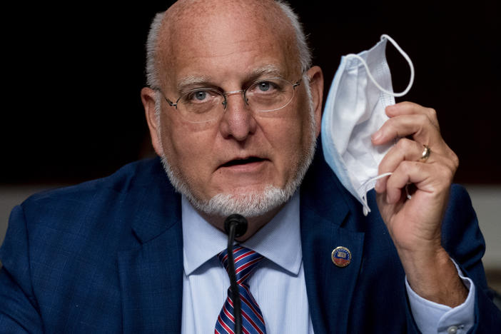 CDC Director Robert Redfield says wearing a mask may provide better protection against COVID-19 than a vaccine.