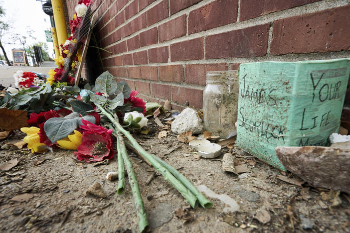 The site of James Scurlock's shooting death in Omaha, Neb., is still being preserved as a memorial in mid-September. On Tuesday, a grand jury indicted Jake Gardner in the killing, handing down four charges including manslaughter.