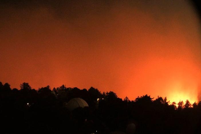 A view facing east from the Mount Wilson Observatory near Los Angeles shows the nearby flames of the Bobcat Fire early Wednesday.