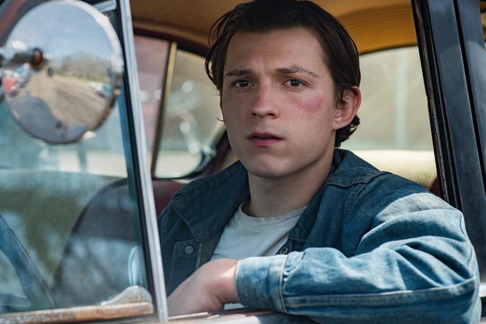 Tom Holland plays Arvin, a young man who refuses to let evil go unpunished in <em>The Devil All the Time. </em>