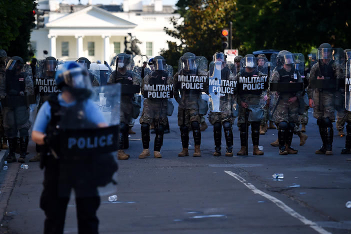 Military police hold a line near the White House on June 1 as demonstrators gather to protest police brutality in Washington, D.C.