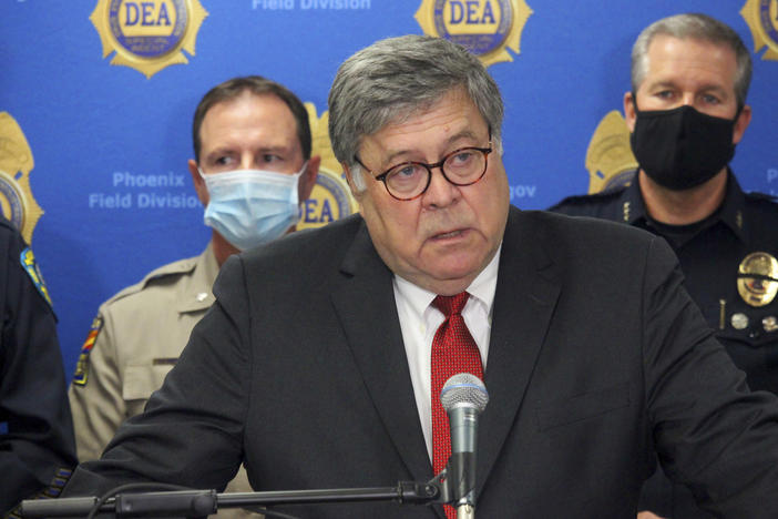 U.S. Attorney General William Barr, seen here in Phoenix on Sept. 10, called his colleagues at the Justice Department a "permanent bureaucracy" in a speech Wednesday.